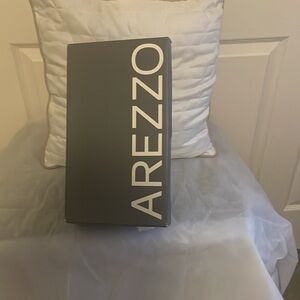 These AREZZO 9.5 never been worn silver shoes very dressy. Asking 39.99.